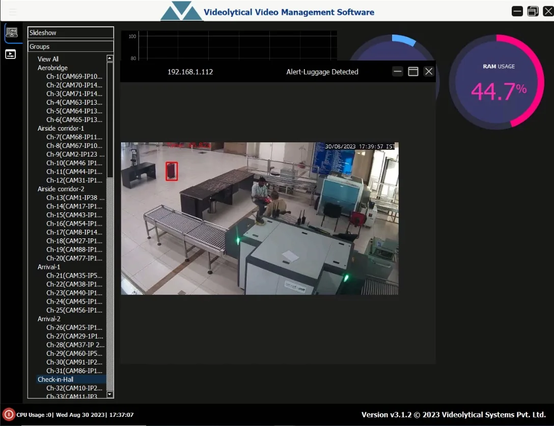 Videolytical video management software window. A camera group tree is on the left, and a pop-up titled "Alert-Luggage Detected" shows a suitcase marked with a red box in a baggage screening area.